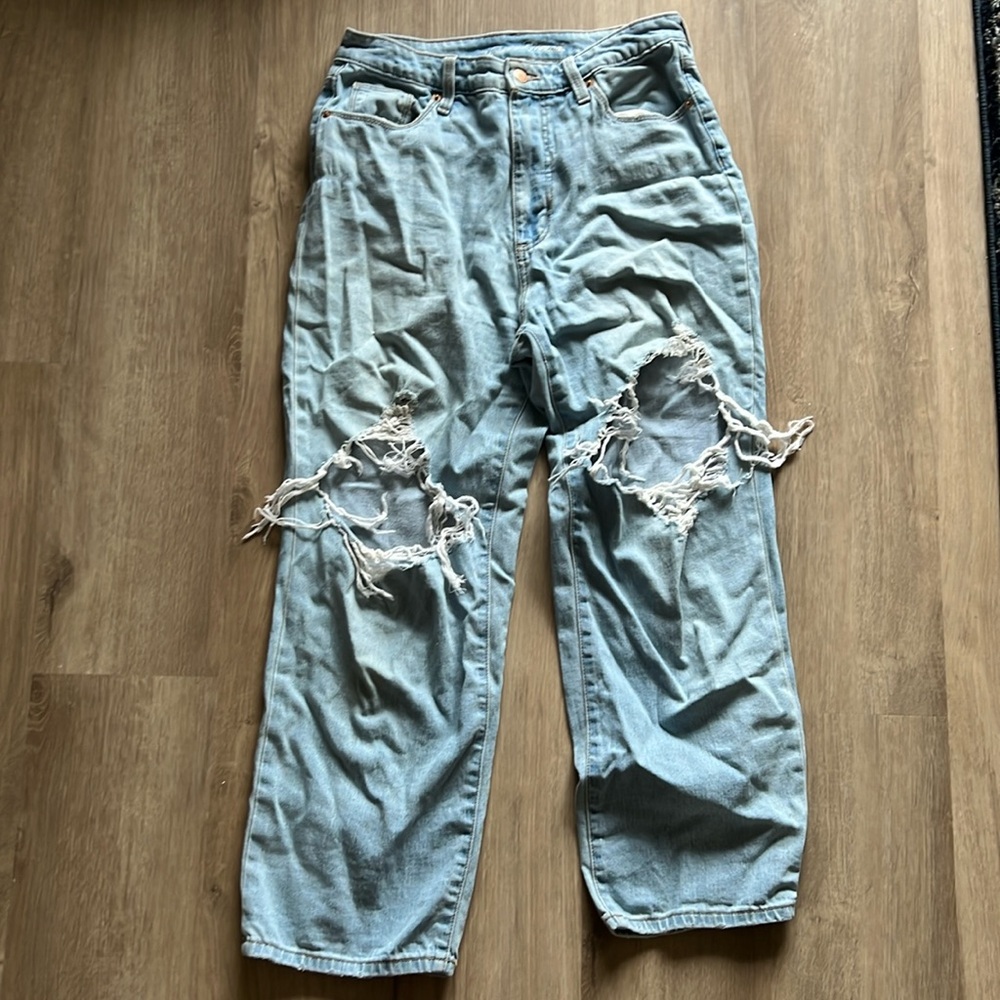 Baggy jeans. Rips at knees. Size 8/29
